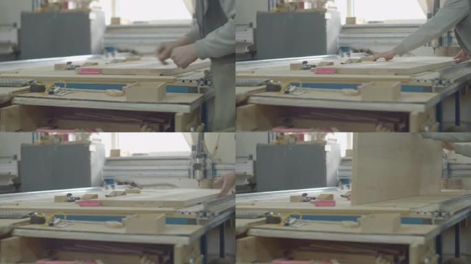 计算机数控机床操作员为动作准备木材。木工车间流程。木制家具制造。