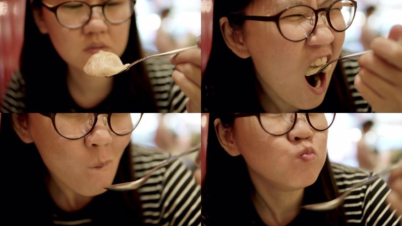 吃香港馄饨或饺子的女人。