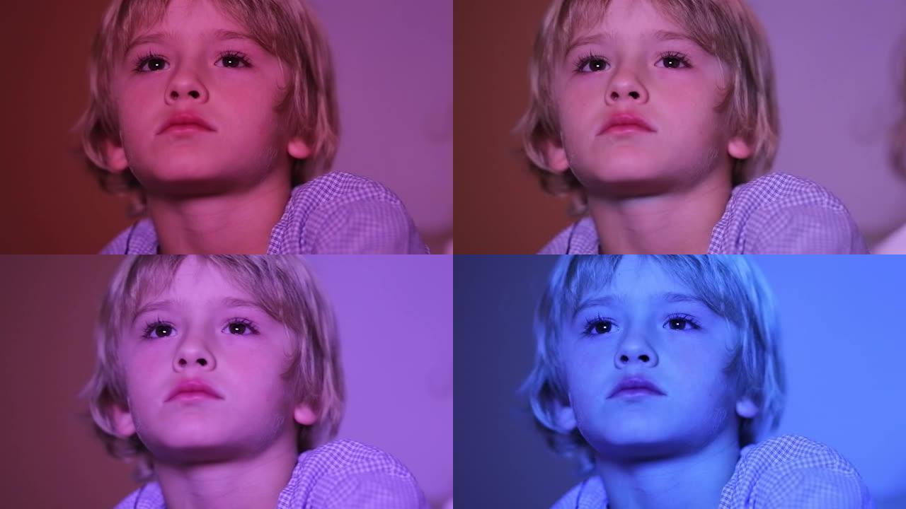 晚上电视屏幕前的小男孩，屏幕变色