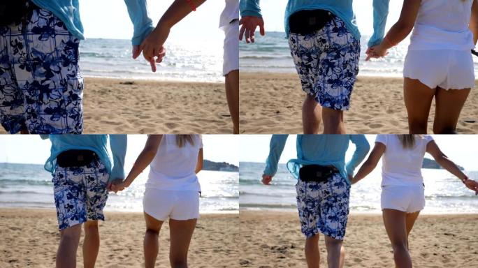 年轻夫妇互相牵手，沿着海滩奔向大海。一对为自由或他们在海洋海岸的暑假而欢欣鼓舞。游客在海岸享受新的风