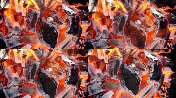 木炭的特写开始在厨房烤架中燃烧。
