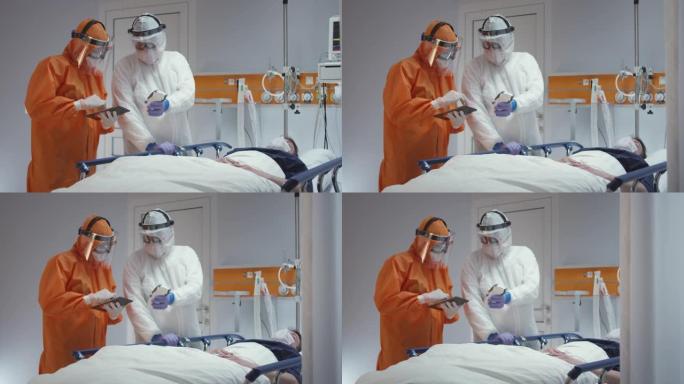 慢动作: 护士穿着防护服测量冠状病毒病人的体温，并咨询领先的医生-多莉射击。在5K R3D中拍摄