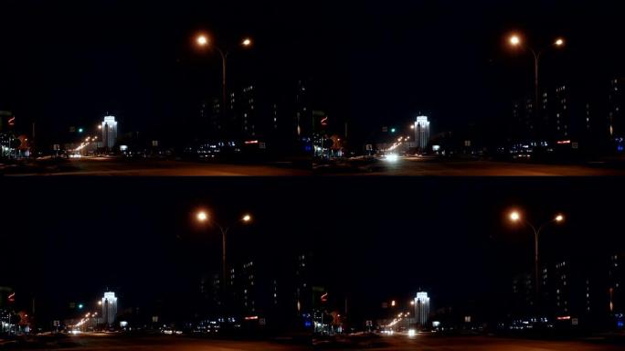 延时车辆在夜间驶过交通信号灯
