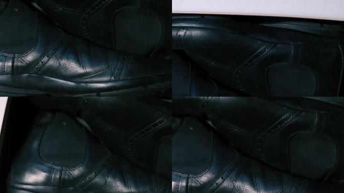 黑色皮革男鞋的特写。