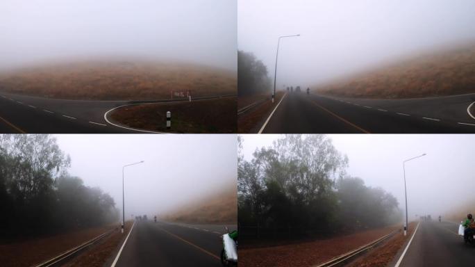 在大雾的日子里，人们早上跑步。