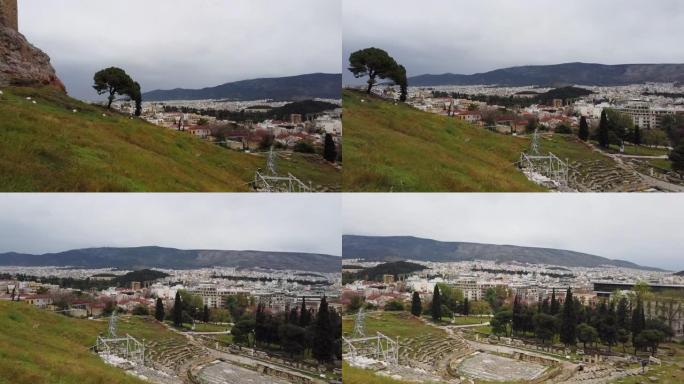 狄俄尼索斯/雅典卫城古代剧院的全景俯视图和希腊阿特恩-伯罗奔尼斯城市的城市天际线