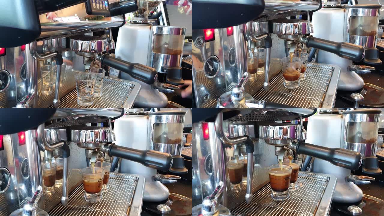 咖啡师用咖啡机在瓶盖里蒸咖啡。