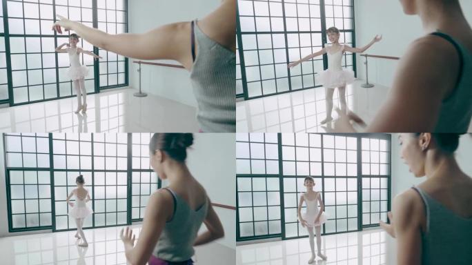 芭蕾舞教练在舞蹈工作室以积极的情感教可爱的混血女孩