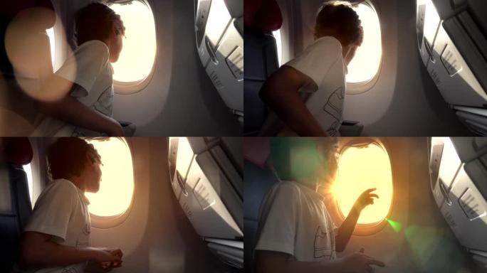 一个坐飞机的男孩看着窗外。