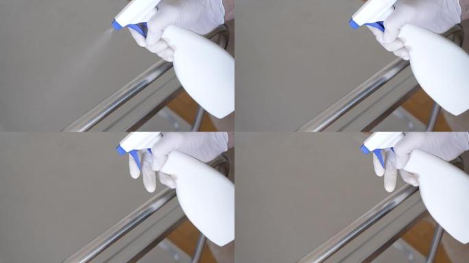 男子消毒金属桌