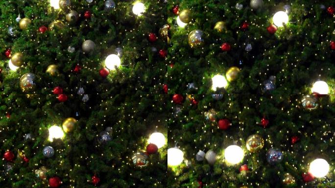 装饰有灯和礼物的圣诞树，金色，银色，彩色球向下移动