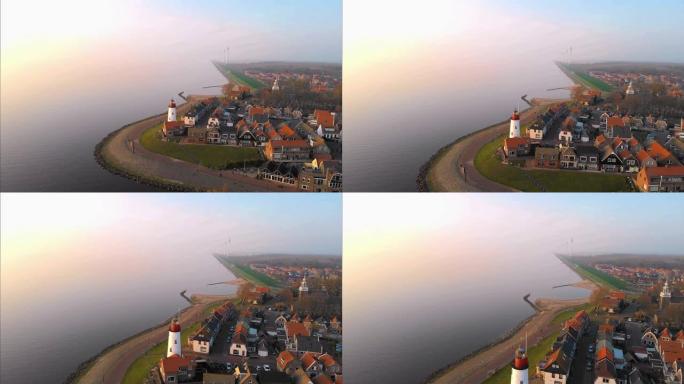 前荷兰urk Flevoland岛上Ijsselmeer湖岩石海滩上的Urk灯塔，鸟瞰荷兰老村庄Ur