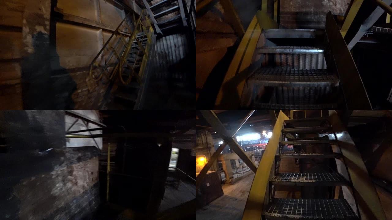 工人在冶金厂上楼。视点，动作相机拍摄。