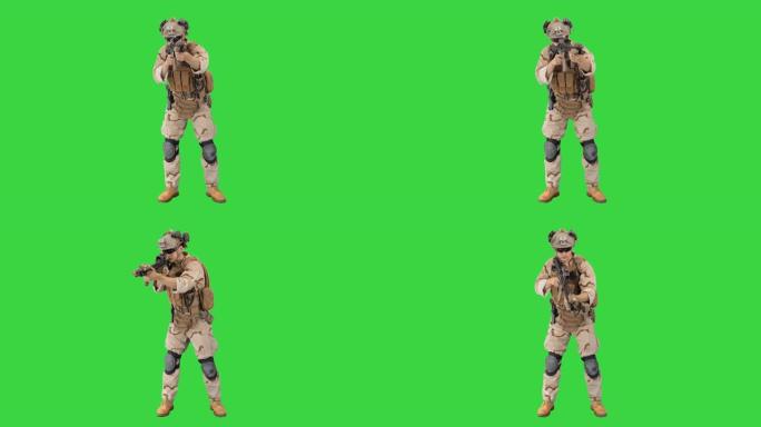 陆军士兵在绿色屏幕上用突击步枪瞄准地面，色键