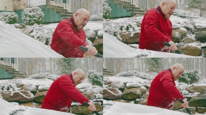 69岁的老人在冬天从雪中清洗汽车。
