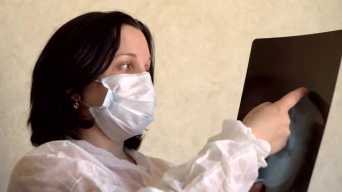戴着医用口罩的年轻女子正在检查x射线