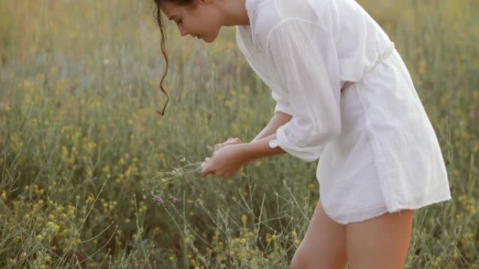 自然美女女孩在自由享受理念户外采花