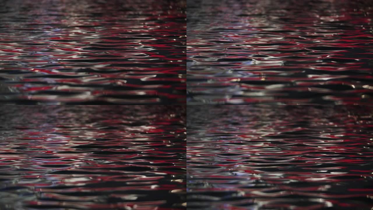 红光反射涟漪水面红光反射涟漪水面波光