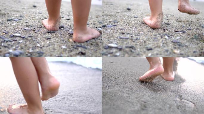 婴儿的脚在沙滩上做第一步，用波浪洗脚