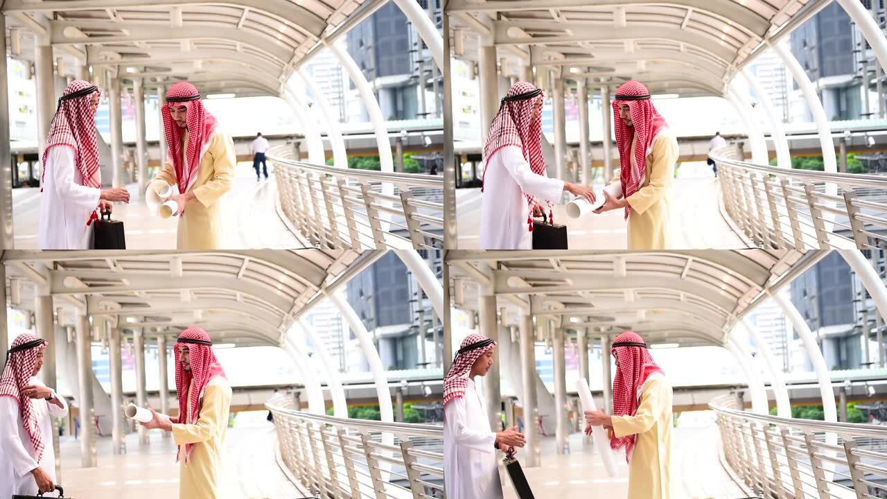 伊斯兰商人在现代穆斯林阿联酋城市握手成功。阿拉伯男子穿着盖头穆斯林连衣裙。多元文化多样性商务人士会谈