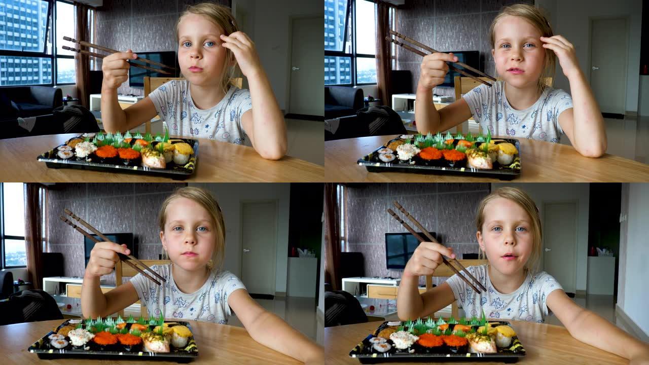 可爱的年轻女孩吃寿司菜单的变化排