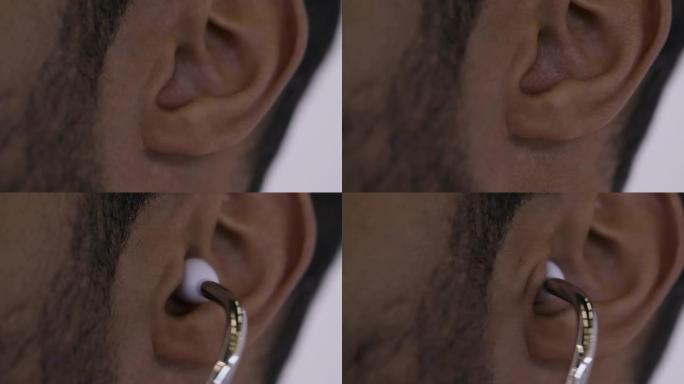 混血男医生或护士将听诊器放入耳朵。