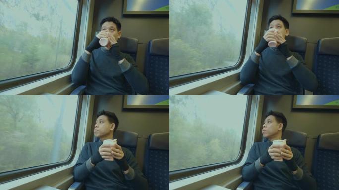 东南亚男子坐在火车上旅行