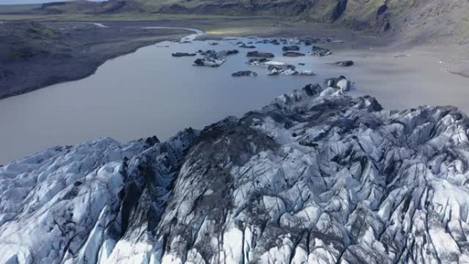 冰岛融化的Solheimajokull冰川的空中4k无人机高角度视图。气候变化，冰川融化，全球变暖概