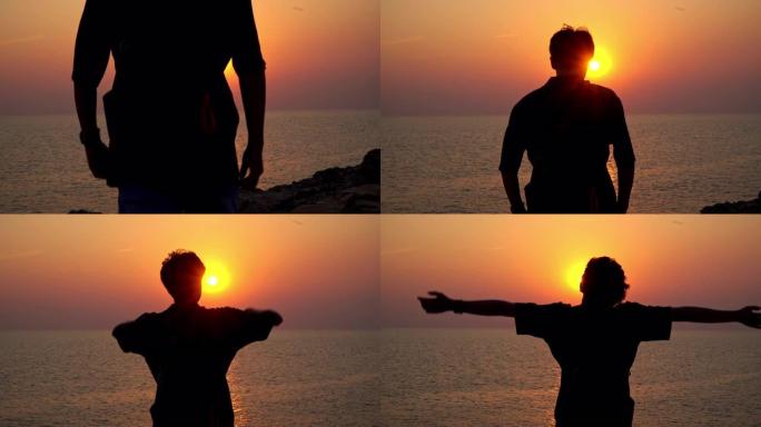 4k后视剪影的年轻亚洲男子旅行者走在岛山海崖上，在夏天的日落和暑假的暮色天空中伸出双臂，感受自由。