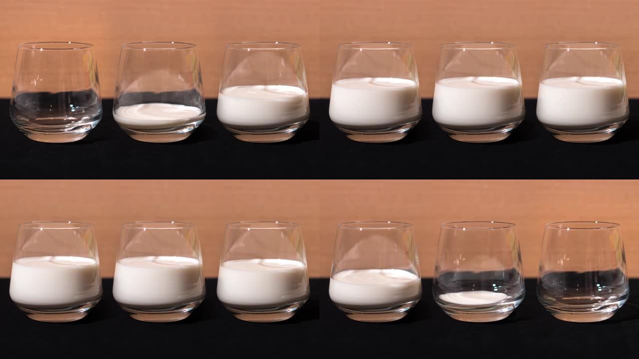 三杯装满牛奶三个杯子