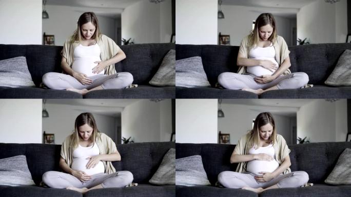 孕妇揉肚子和婴儿说话的前视图