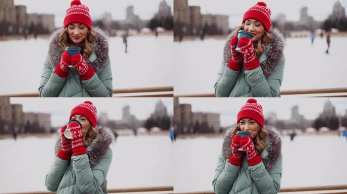 美丽可爱的中年女孩卷发保暖冬季夹克站在冰场背景城镇广场。