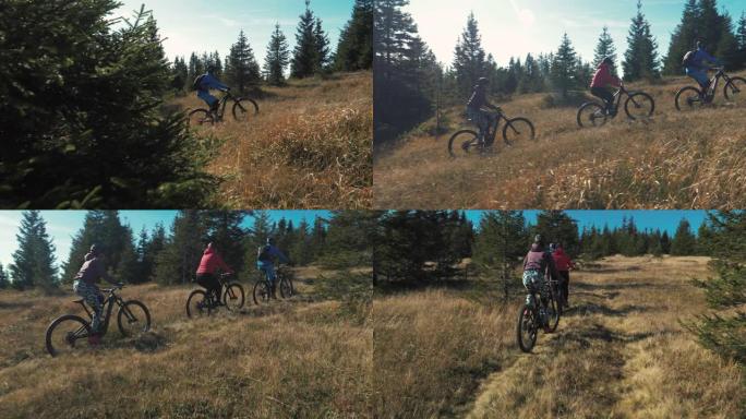在森林环绕的大自然中，朋友们在狭窄的山路上骑自行车的镜头。