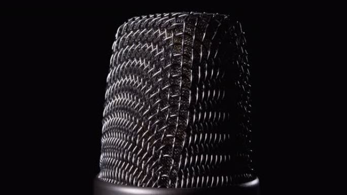 Studio Condenser Microphone Rotates on Black Backg