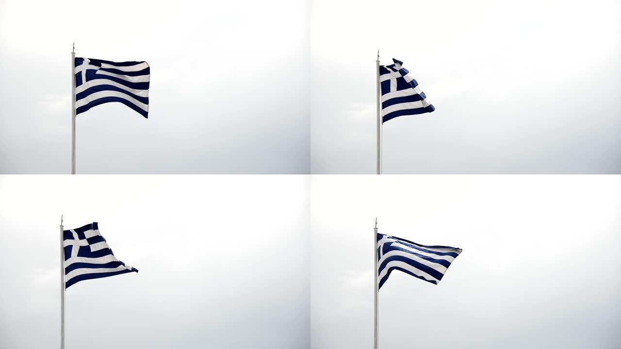 在多云的天空上挥舞着希腊国旗。