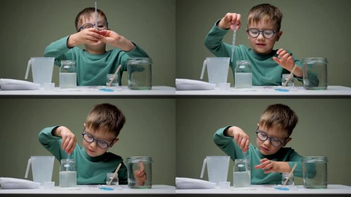 童年科学家在化学实验室学习。男孩，学生在桌子上的科学课上学习和做化学实验，手拿试管。教育理念