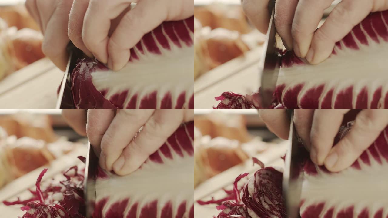 在砧板上切割菊苣切菜小刀特写