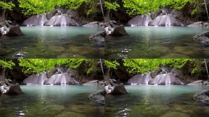 泰国北碧府的四面瀑布4楼。森林深处美丽的瀑布，大自然中有翡翠池和锑鱼。