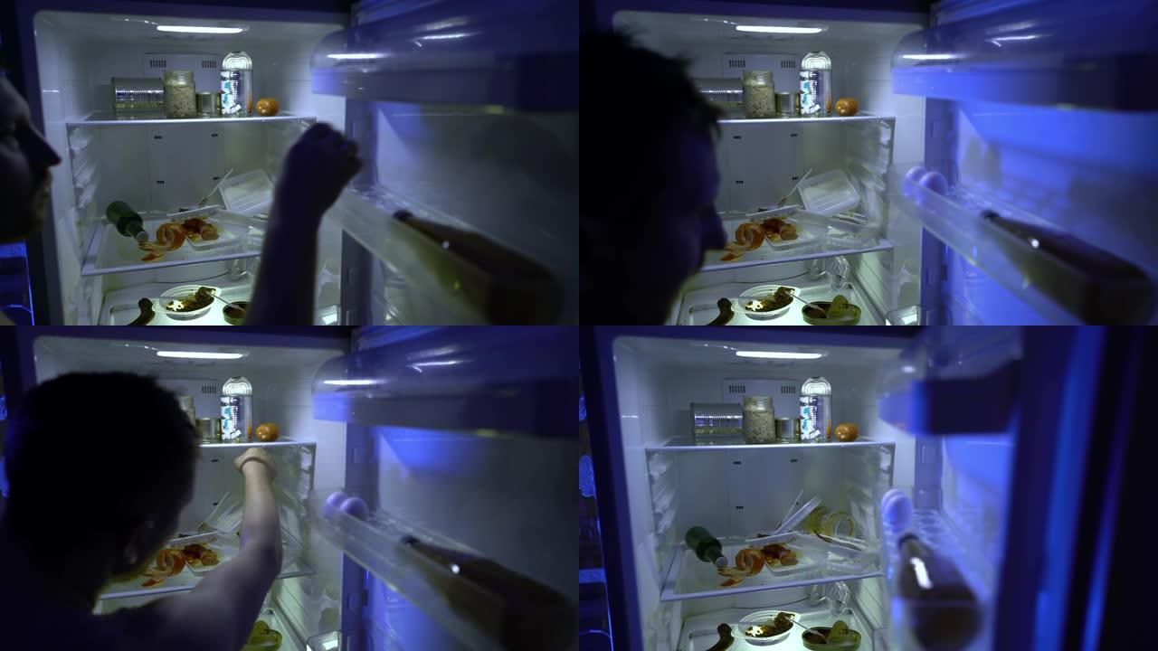 在冰箱里找食物的人。这个人打开冰箱，把鸡蛋放进里面。