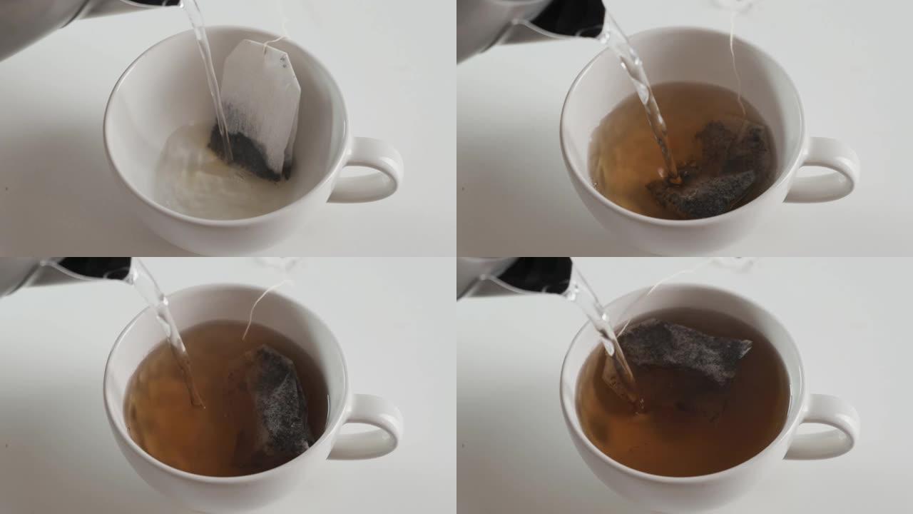 慢动作镜头茶包是用白色杯子冲泡的。特写。
