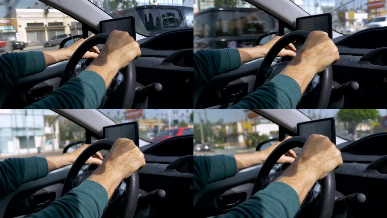 一名男子在白天驾驶和操作GPS的手持镜头