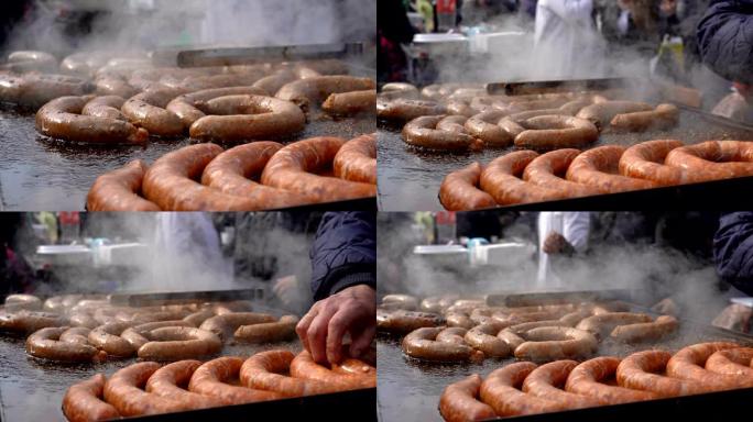 街头食品市场小贩烹饪和销售香肠-缩小