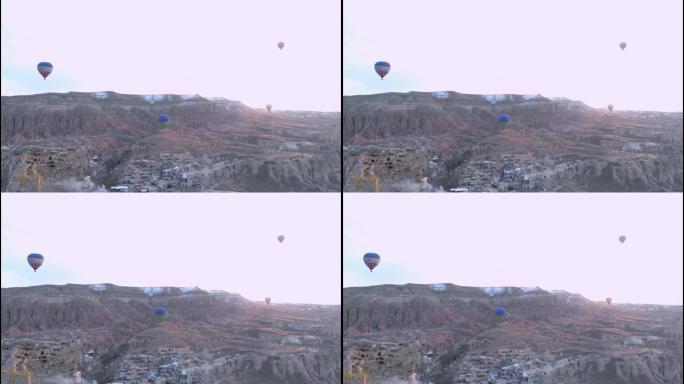 许多热气球飞越卡帕多西亚的山谷