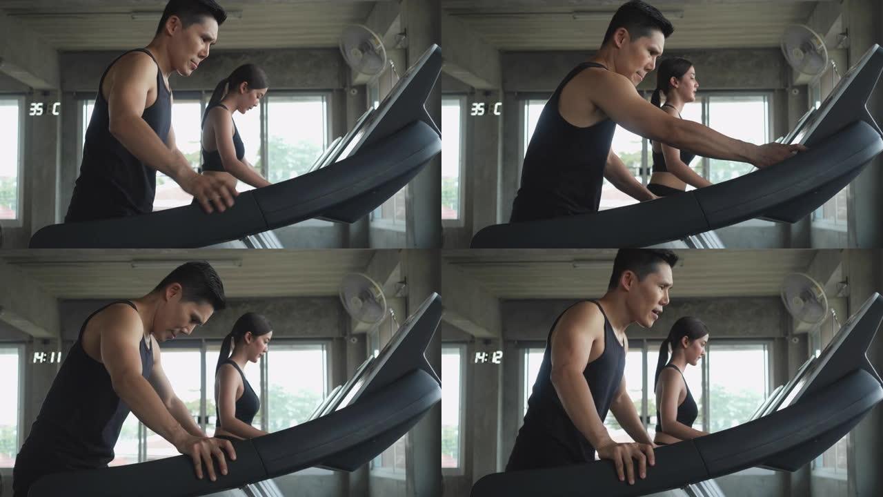 穿着运动服的亚洲运动男女在健身房的跑步机上跑步进行耐力训练，以增强和锻炼肌肉。健身、健康生活方式和燃