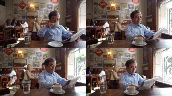 小男人在咖啡馆读报纸