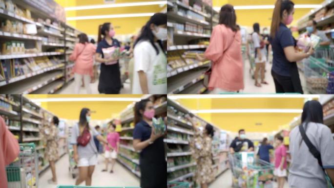 泰国政府宣布关闭泰国后，模糊的背景人群购买和购物以储备带有口罩保护的食品。