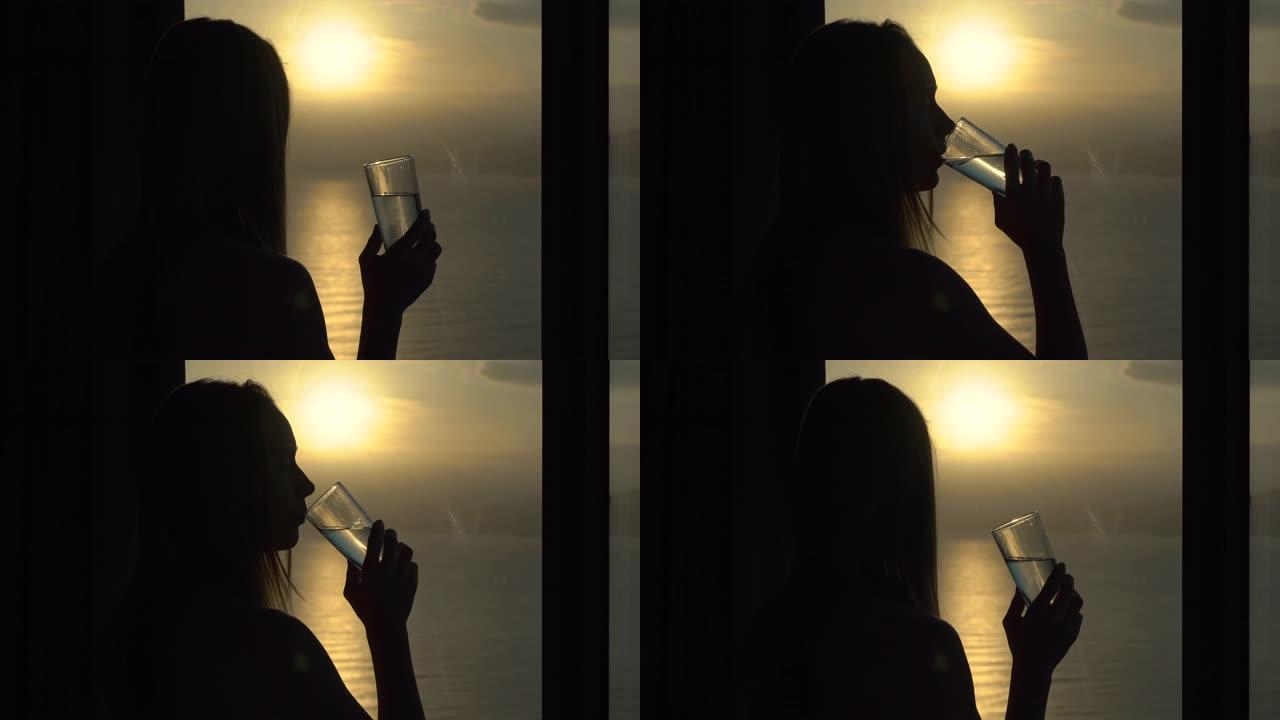 一个年轻女子在公寓里，可以看到海岸和日出的全景。她戴上无线耳机听音乐