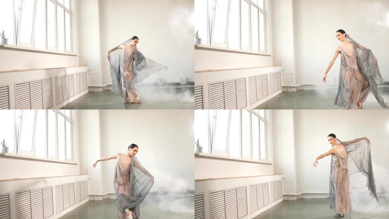 雾中的工作室灰色背景上的现代风格芭蕾舞演员