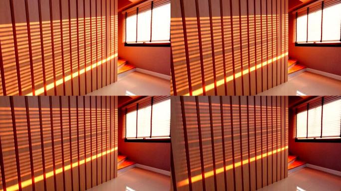 美丽的窗户盲影图案运动图形木墙创意室内设计与阳光的橙色