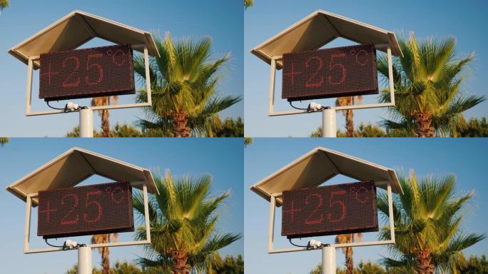 海滩上的温度计记分牌显示温度为25摄氏度